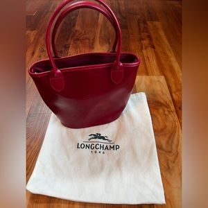 Longchamp red leather bucket bag.